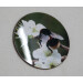 Buff tail bumblebee round coaster, queen on wild plum blossom, angle surface view