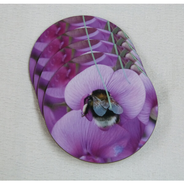 Four garden bumblebee round coasters, pink sweetpea flower, spread view